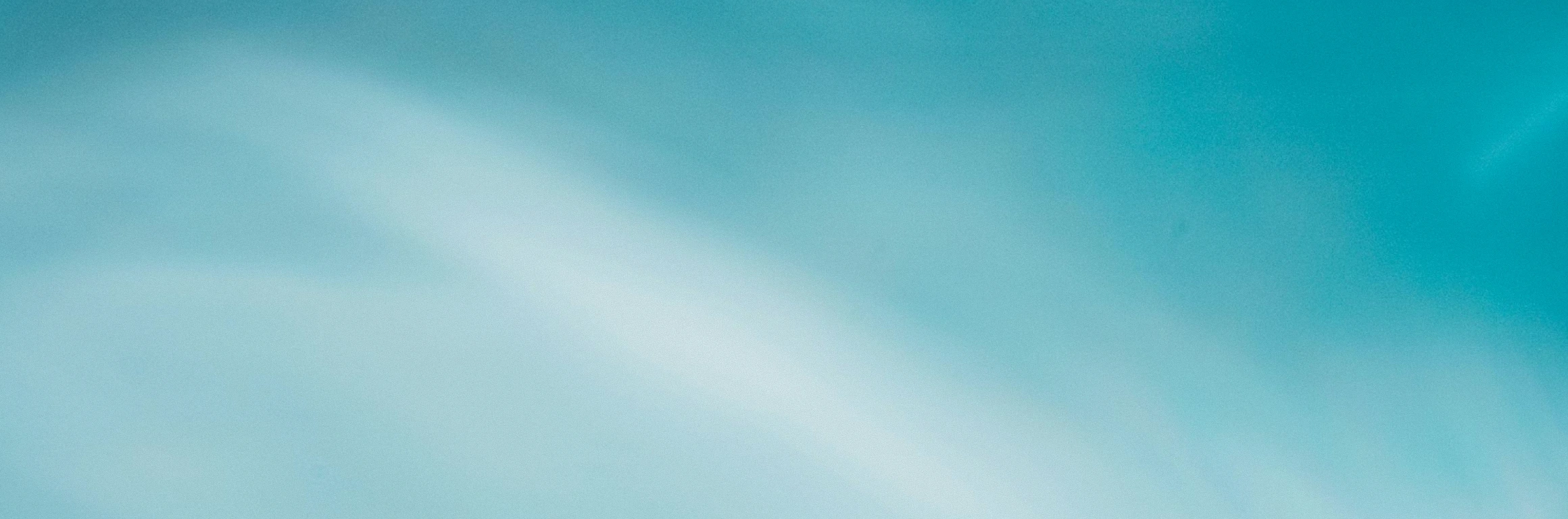 Soft gradient background blending shades of light blue and turquoise.